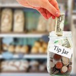 Tip jar money in a restaurant