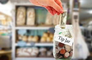 Tip jar money in a restaurant